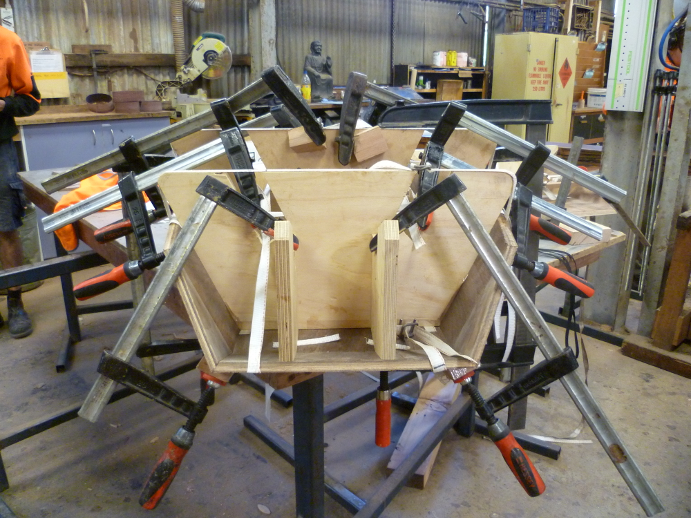An army of clamps and jigs create the precise angles in Polyhedrica
