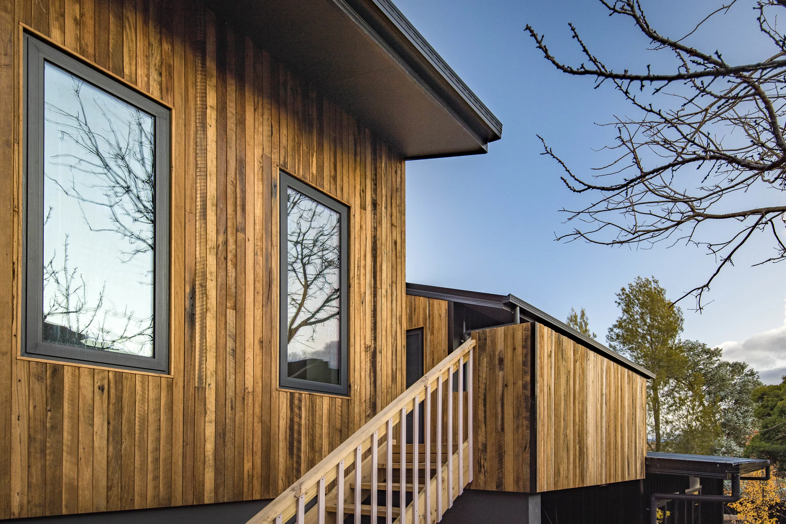 A Canberra house clad in “sawtooth” recycled Blackbutt. The timber colour can be maintained with our Osmo finish, or left to grey in the elements.