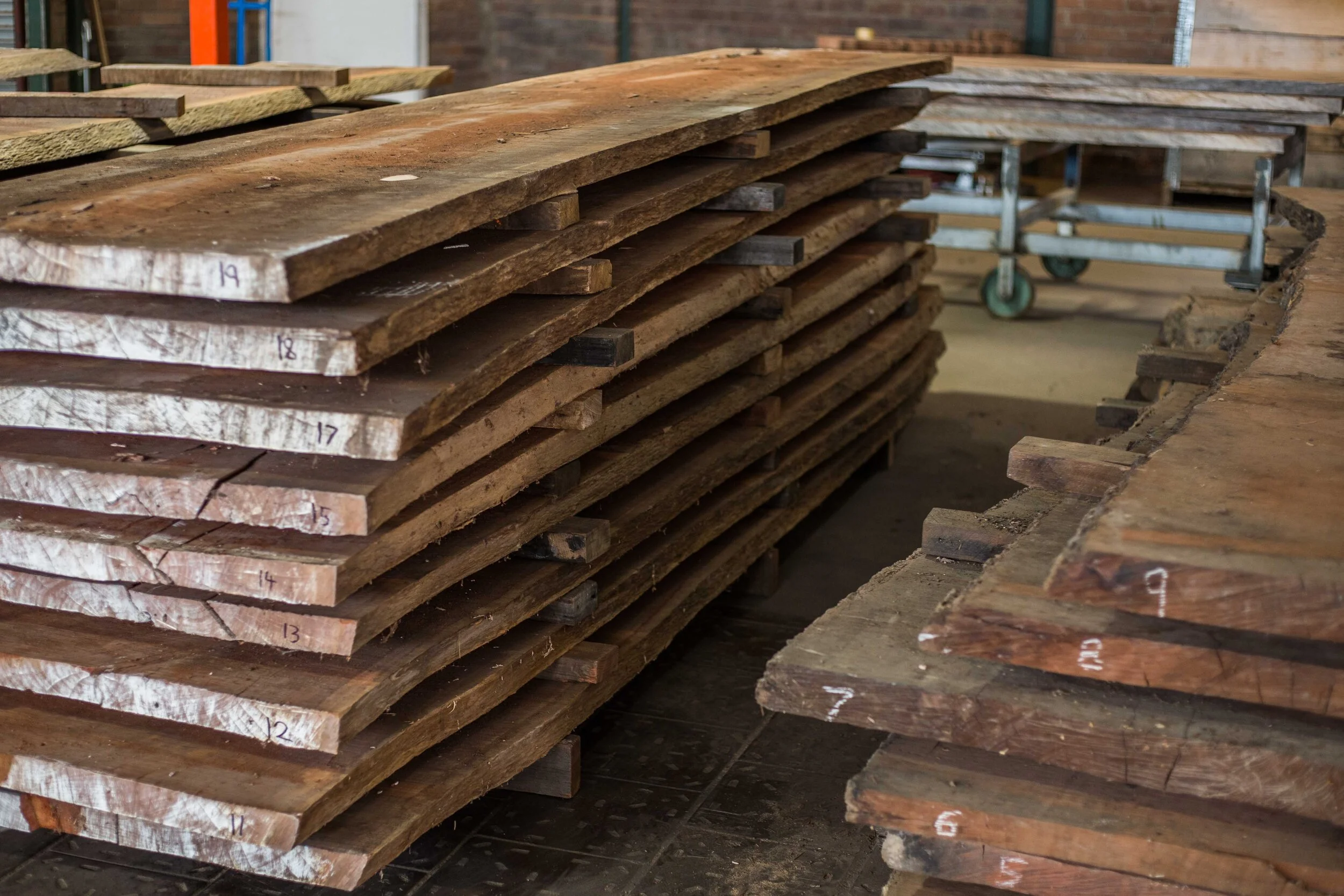 A new stack of Red Gum slabs stacked for drying in the workshop.