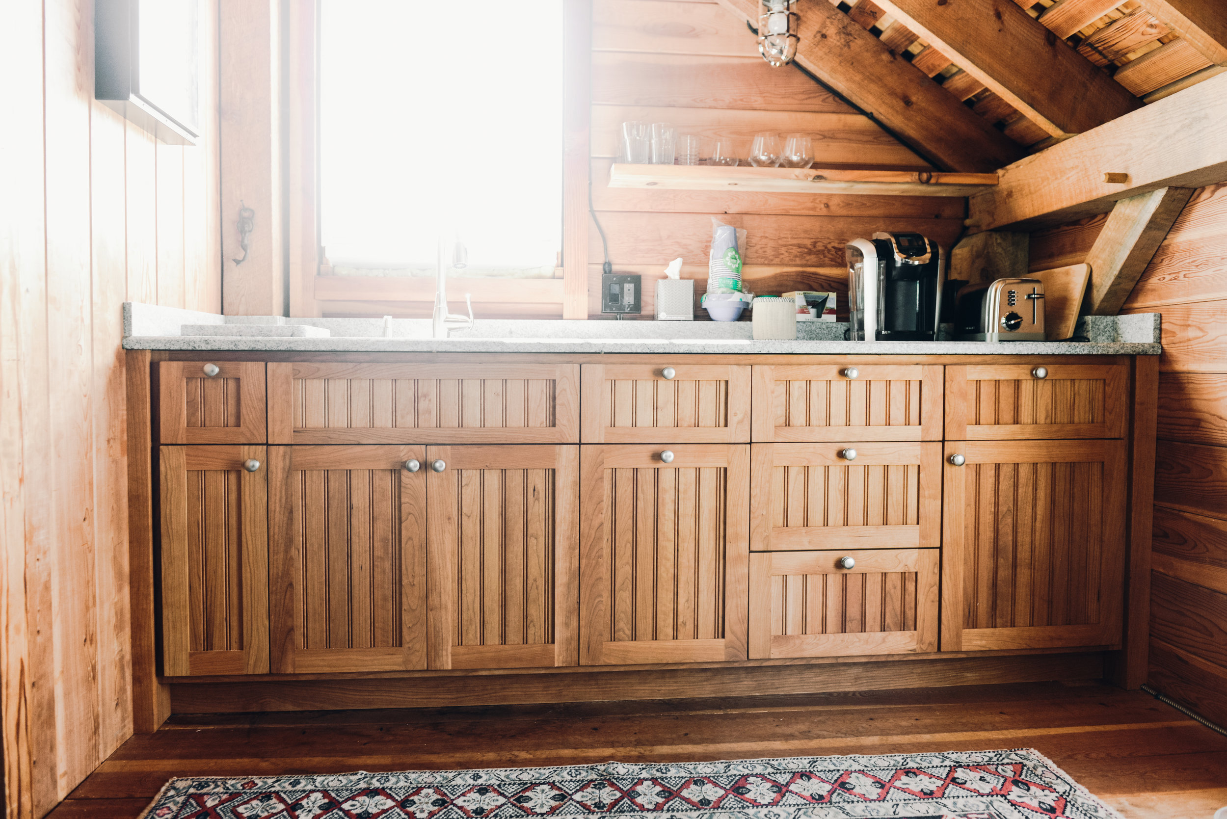 Cherry beadboard cabinets with granite countertop