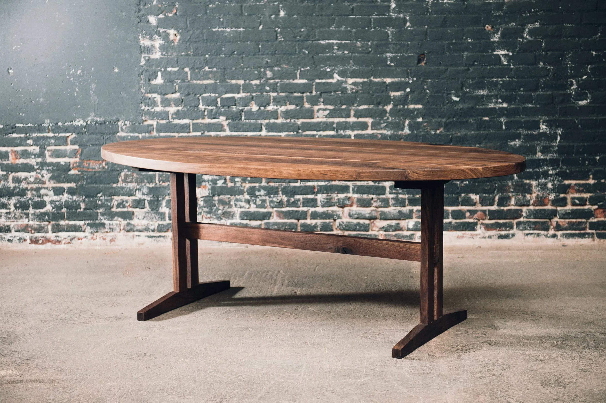 7' oval with walnut base