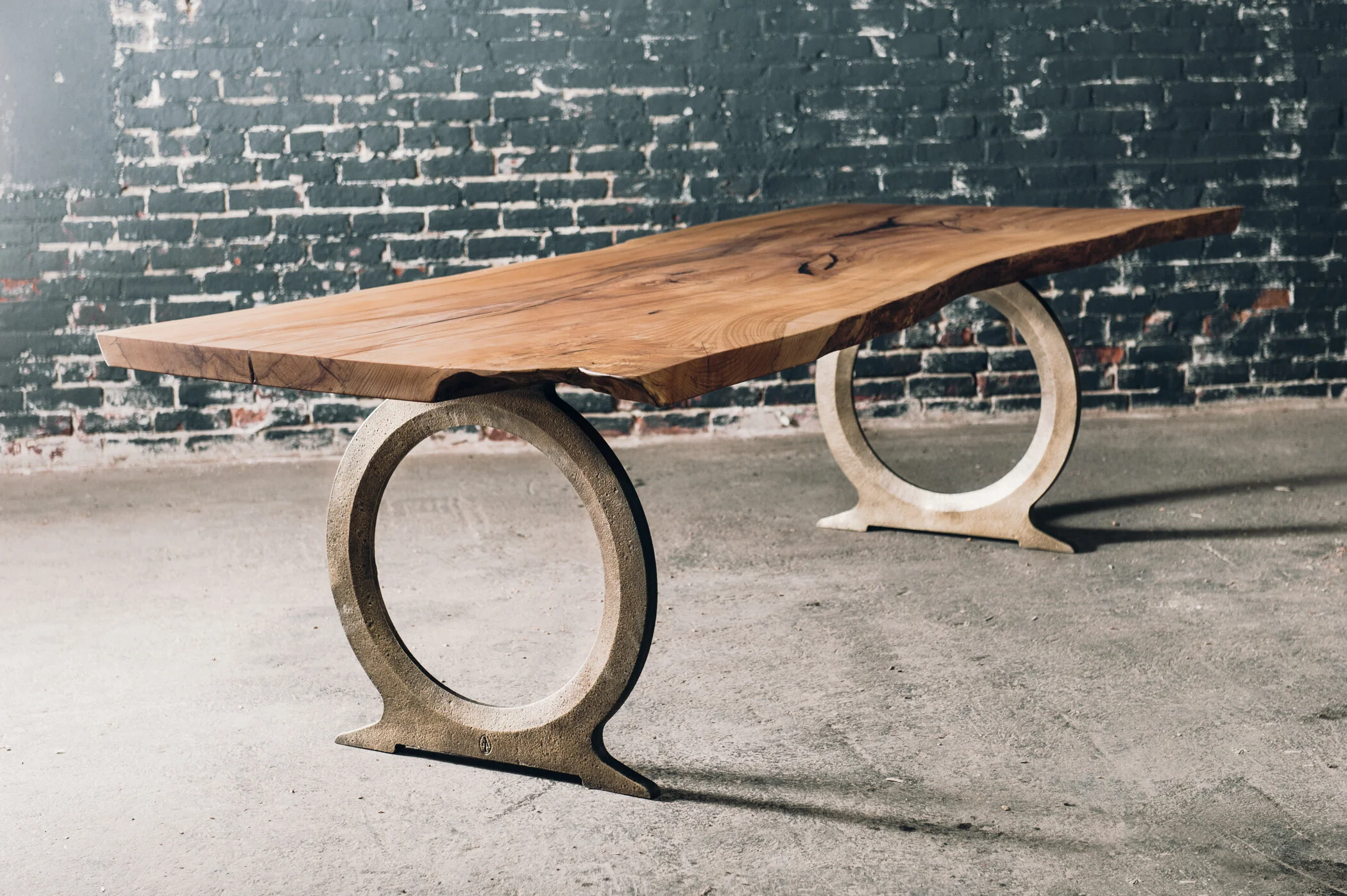 Slab table with bronze cast iron base