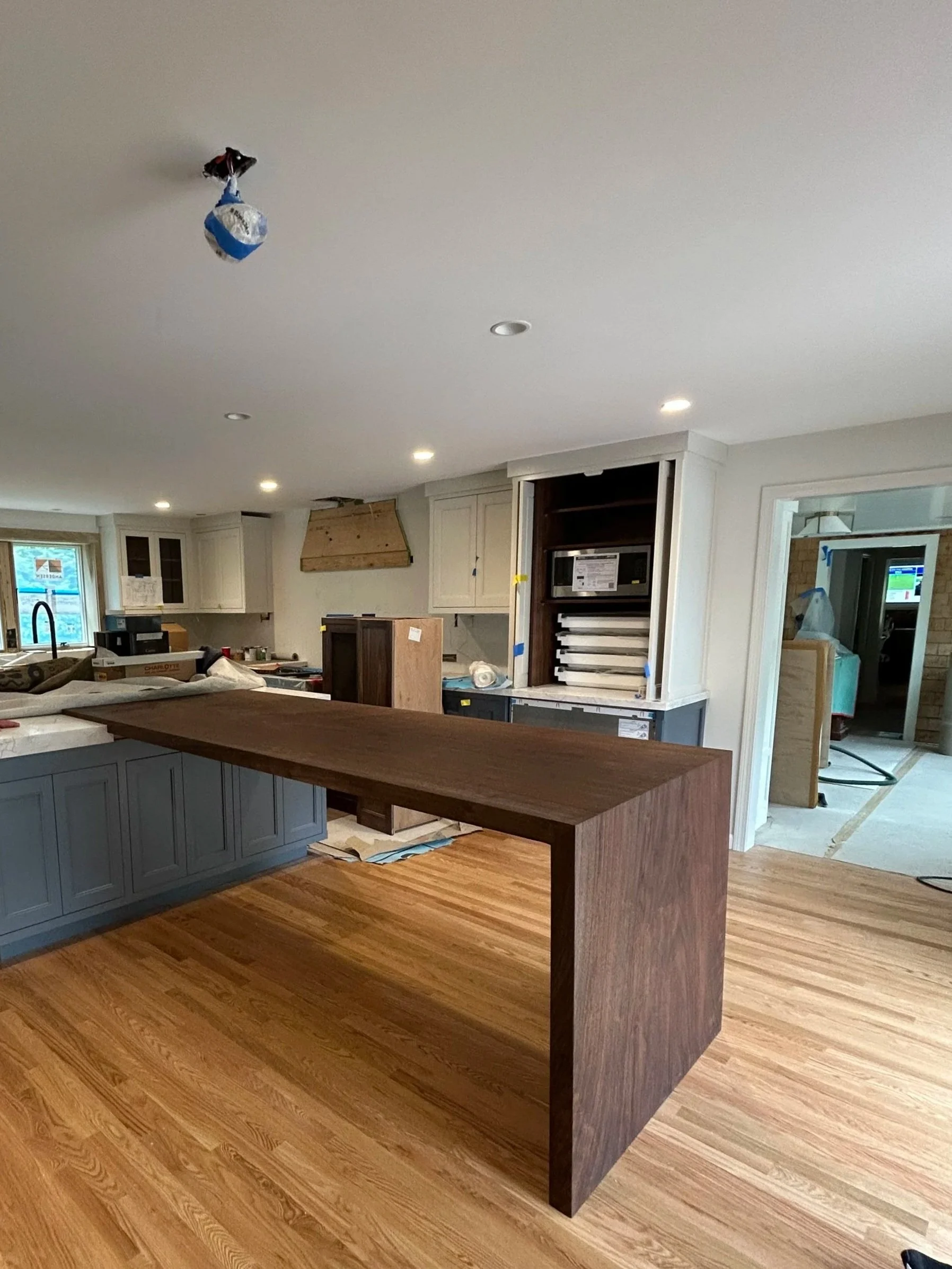Kitchen island in walnut waterfall