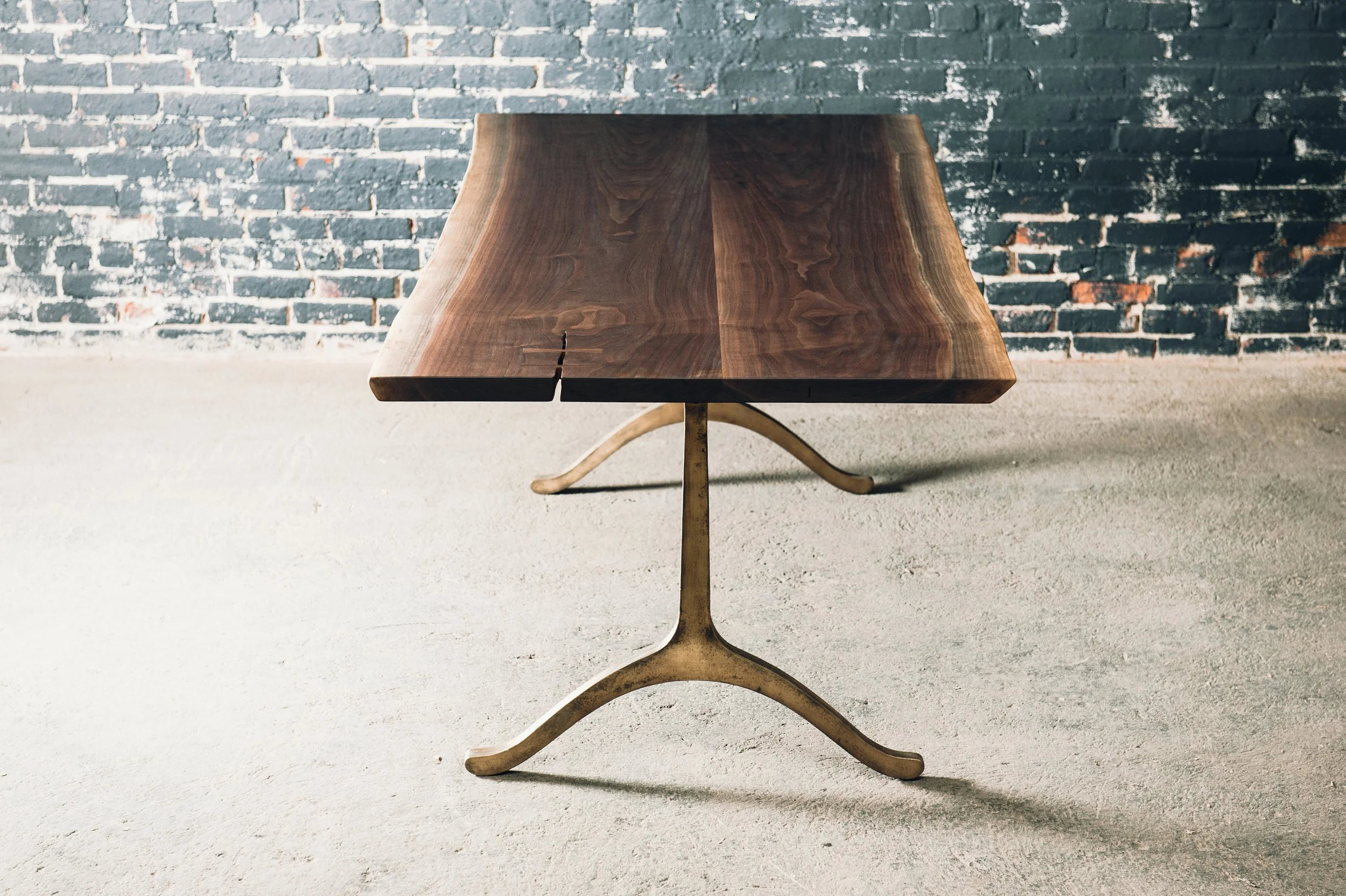 Walnut slabs with bronze cast iron base