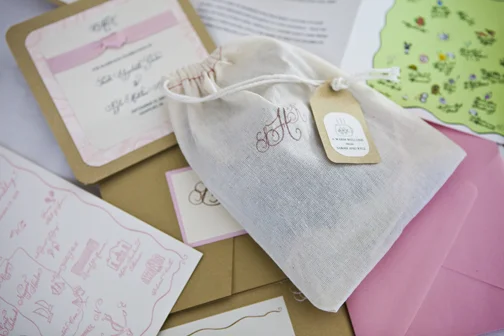 This bride had a simple but elegant fabric bag with a custom rubber stamp with their monogram. Photo: Kristin Spencer