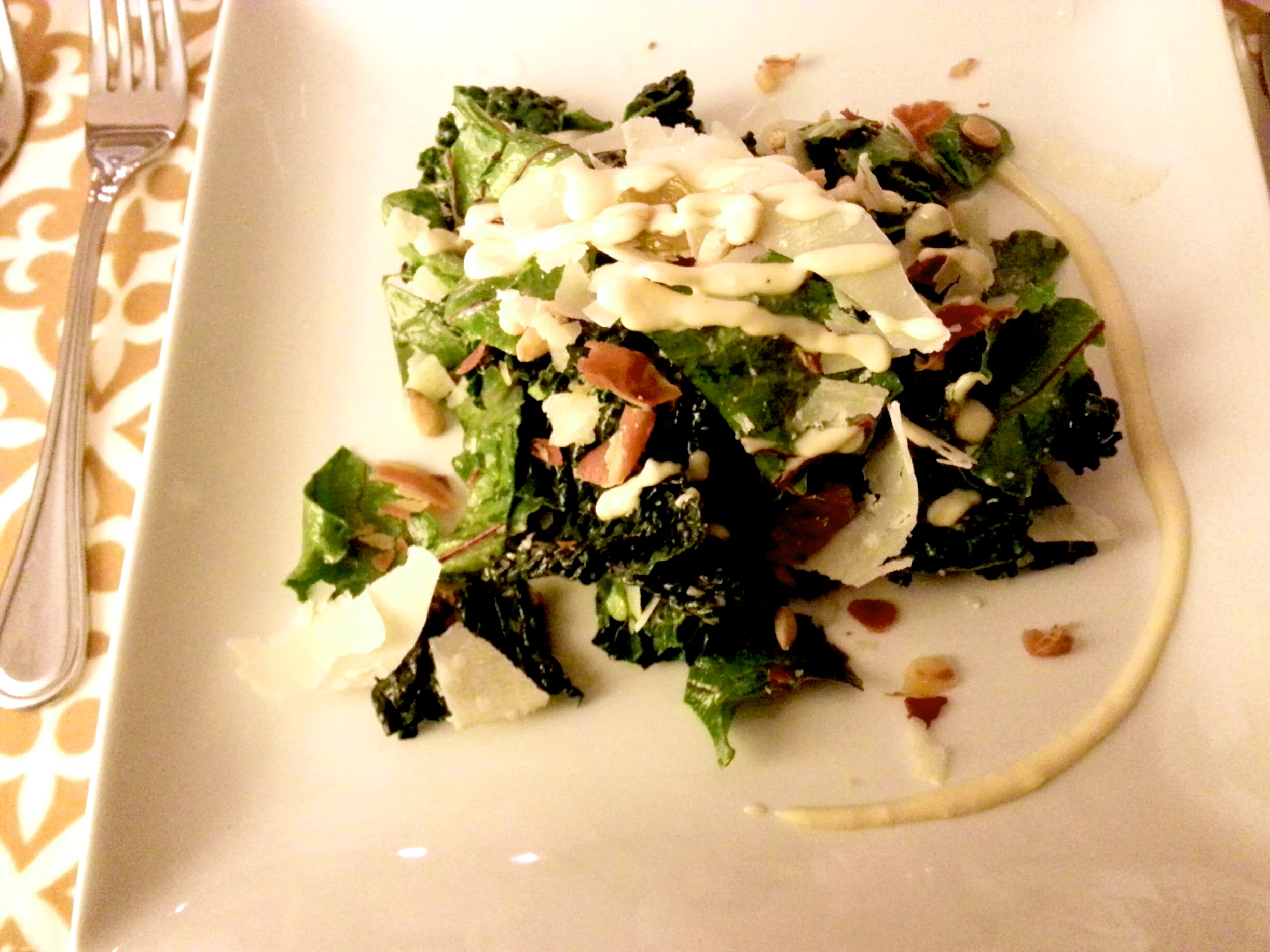 Kale & Beet Green Salad; Toasted Pancetta, Toasted Pine Nuts, Golden Raisins and Shaved Parmiggiano Reggiano with Champagne Vinaigrette 