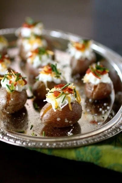 These mini loaded baked potatoes can have so many different kinds of toppings. We love that you can just pop the entire thing in your mouth and there is no waste!