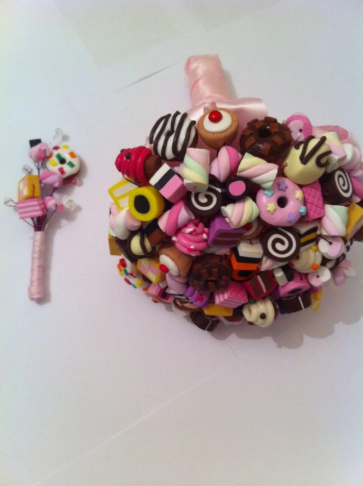 Even though this candy Boutonnière is made of clay, we had to include it for the smile factor it gave to use when we found it online! We love it paired with this candy bouquet for a totally fun combo!
