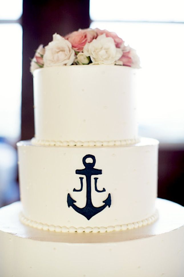 The anchor detail on the wedding cake is befitting any great miltary couple!