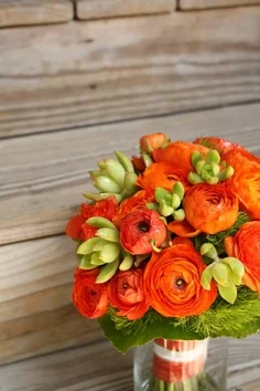 The texture of the rannunculus , the feathery fern and succulents make this bouquet really sing!