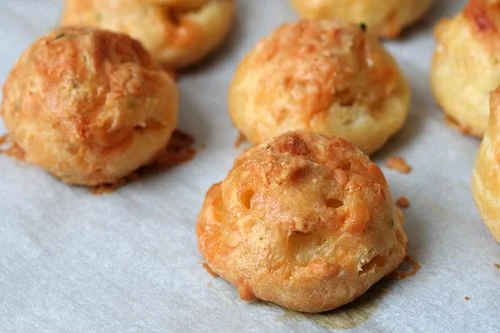 Gougères - or a French cheese puff, are easy to make and impressive to serve at a cocktail hour. You can personalize them using a local cheese so personalize them for your wedding. The combinations are endless!