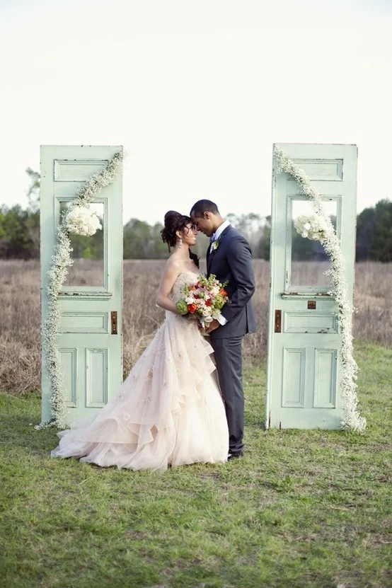These Mint Green ceremony doors create quite the backdrop in this photo! We love it!