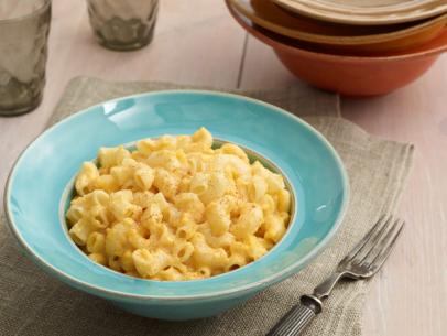 Trisha Yearwood's Slow Cooker Macaroni and Cheese Recipe - Last but not least is one of our favorite side dishes - Macaroni and Cheese. OH yum oh yum! But if you don't want to bring out a box of the bright powdered orange kind, we urge you to try this amazing recipe. Not only is it easy to assemble but you can make it right in your slow cooker. Be warned that this is a RICH Macaroni and Cheese. I've served it at Baby Showers (with sides of peas, lobster, bacon, etc) and I've made it for gangs of kids. It is always devoured and declared "the best macaroni and cheese!". We think so too! 