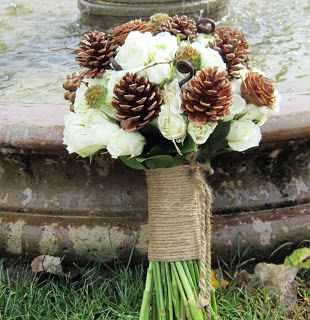 Pine Cone Wedding Bouquet - We love so many things about this bouquet - the pine cones, the rope handle, the fiddlehead ferns and the creamy white roses!