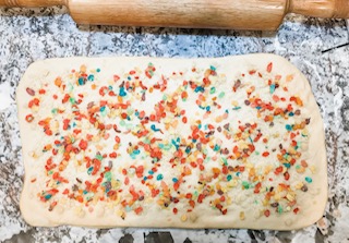adding filling and cereal to cereal milk bun dough.jpg