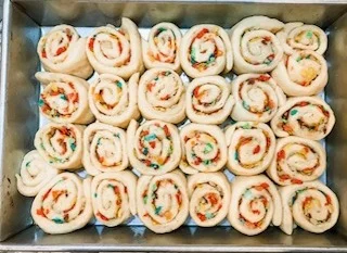 slices of cereal milk buns in pan before rising.jpg