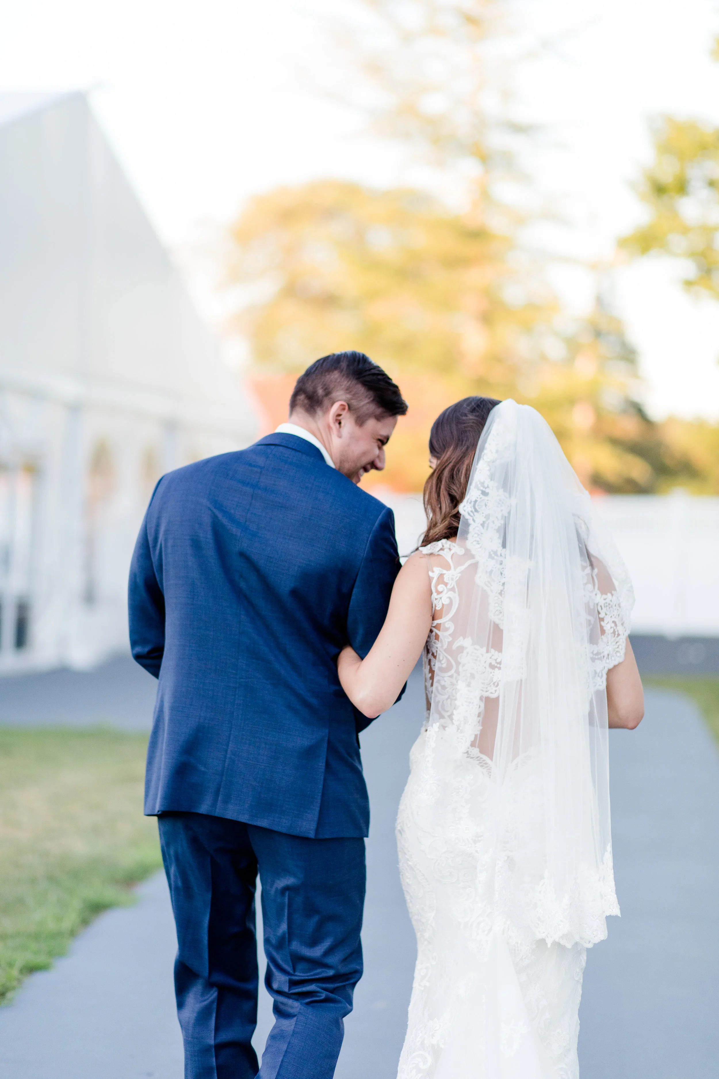 Dione + David share a laugh moments after saying “I do” at their Villa at Ridder Country Club wedding (East Bridgewater, MA)