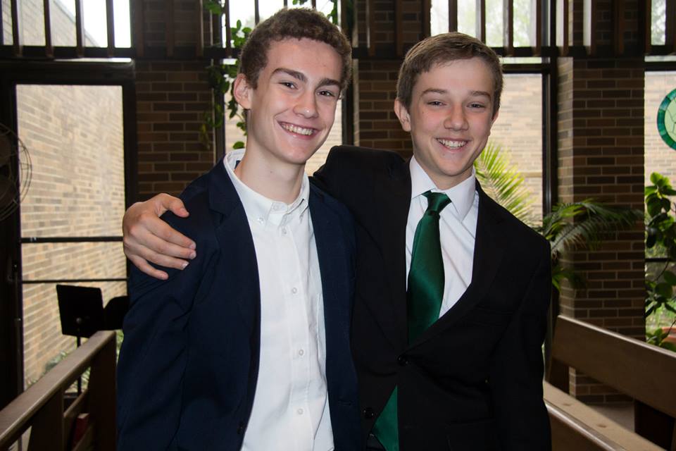  8th graders Matthew and Edward celebrate their presentations. Photo by Tami Barbour 