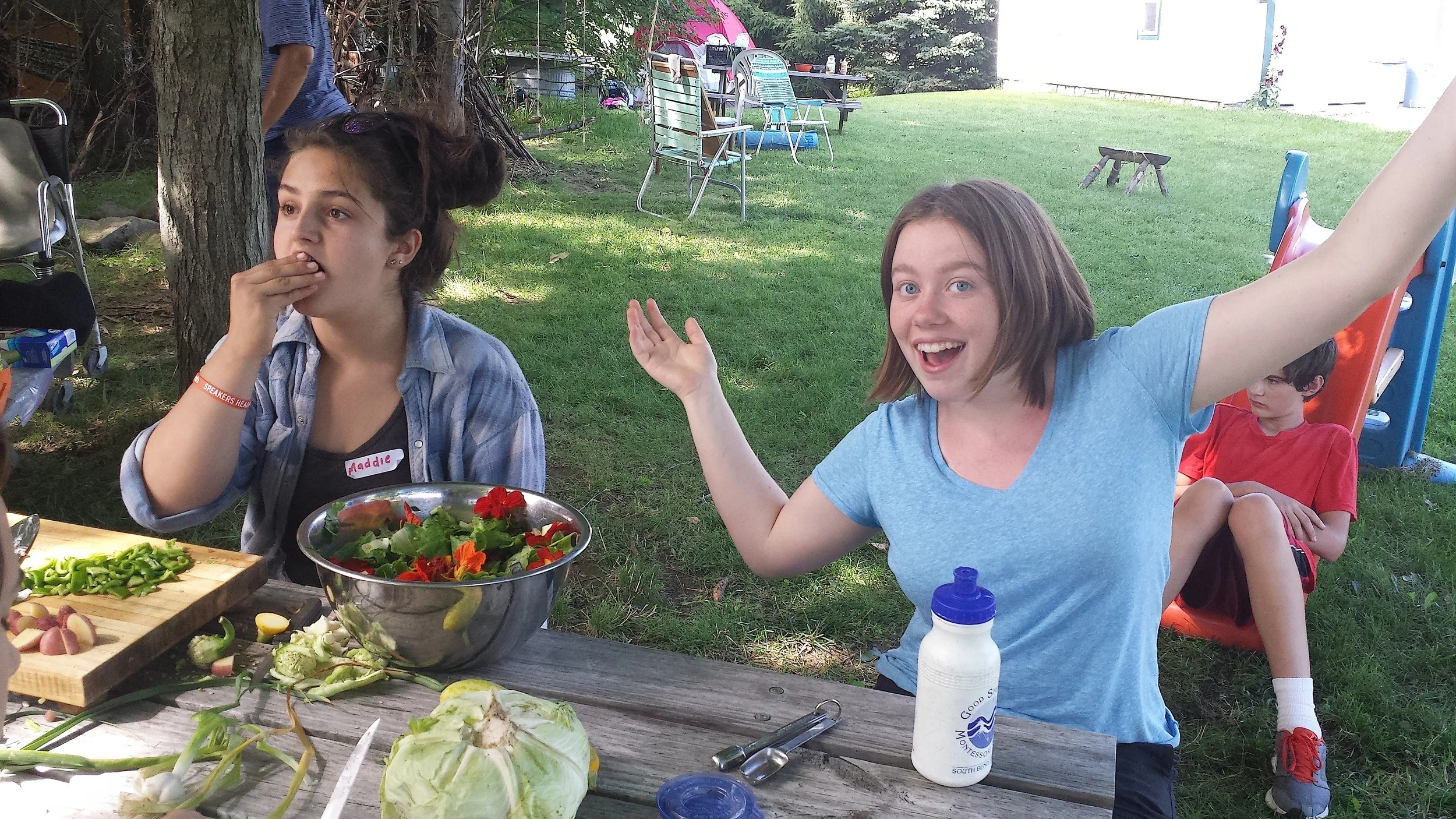Maddie, left, from Indianapolis, and the author, Julia, on the right, prepare locally sourced food for dinner.