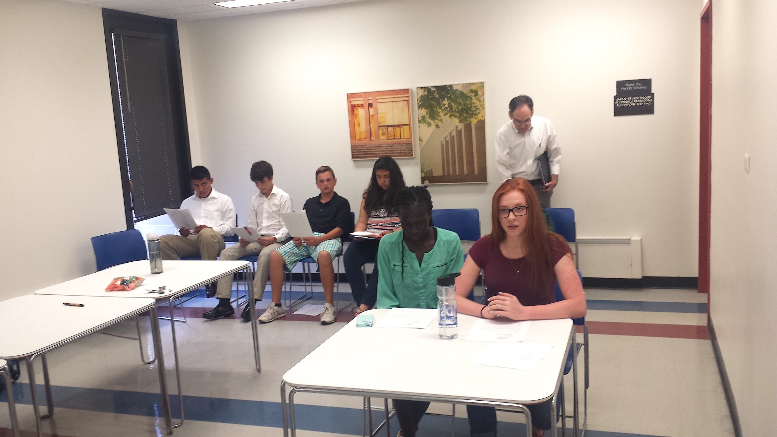 The Climate Restoration team practices before the meeting.