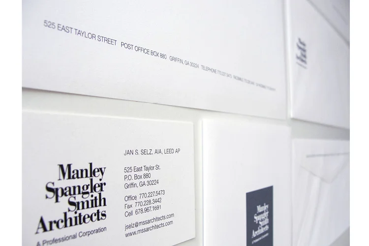 Business collateral and marketing materials, from business cards to a gatefold brochure.
