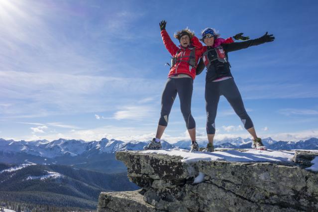 happy-women-smiling-hiking-on-summit.jpg