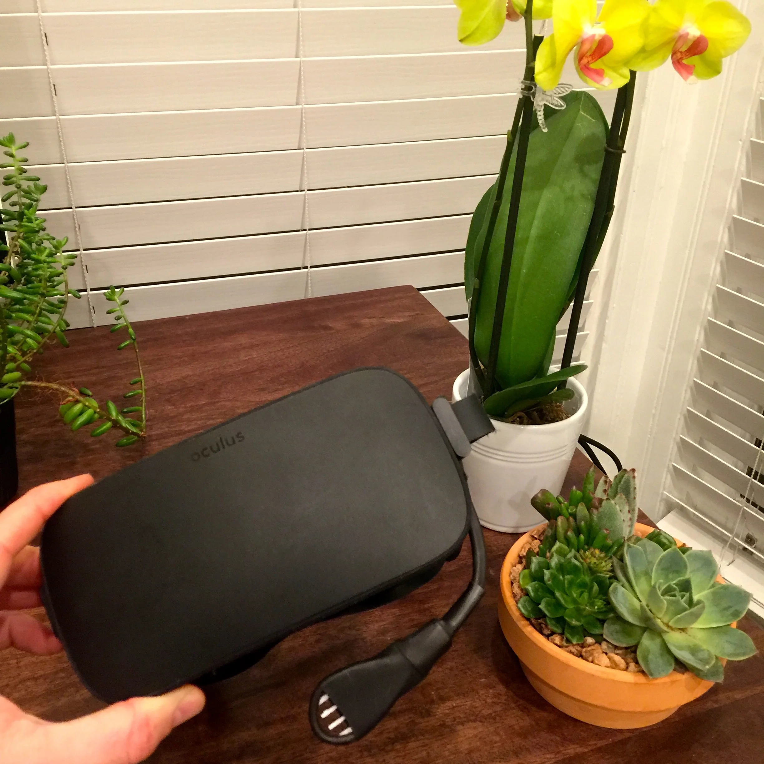 A breathing sensor that measures airflow out of the mouth of a VR user