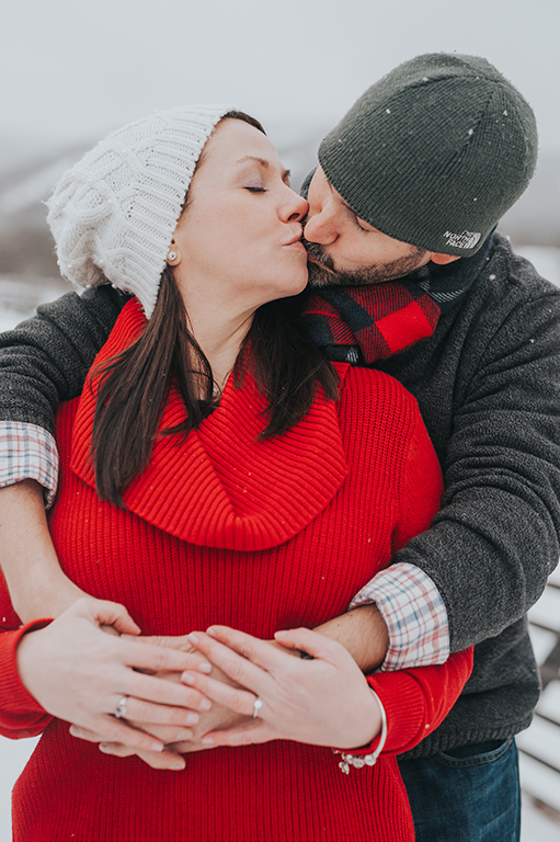 winter-engagement-couple-kissing-killington-vermont.jpg