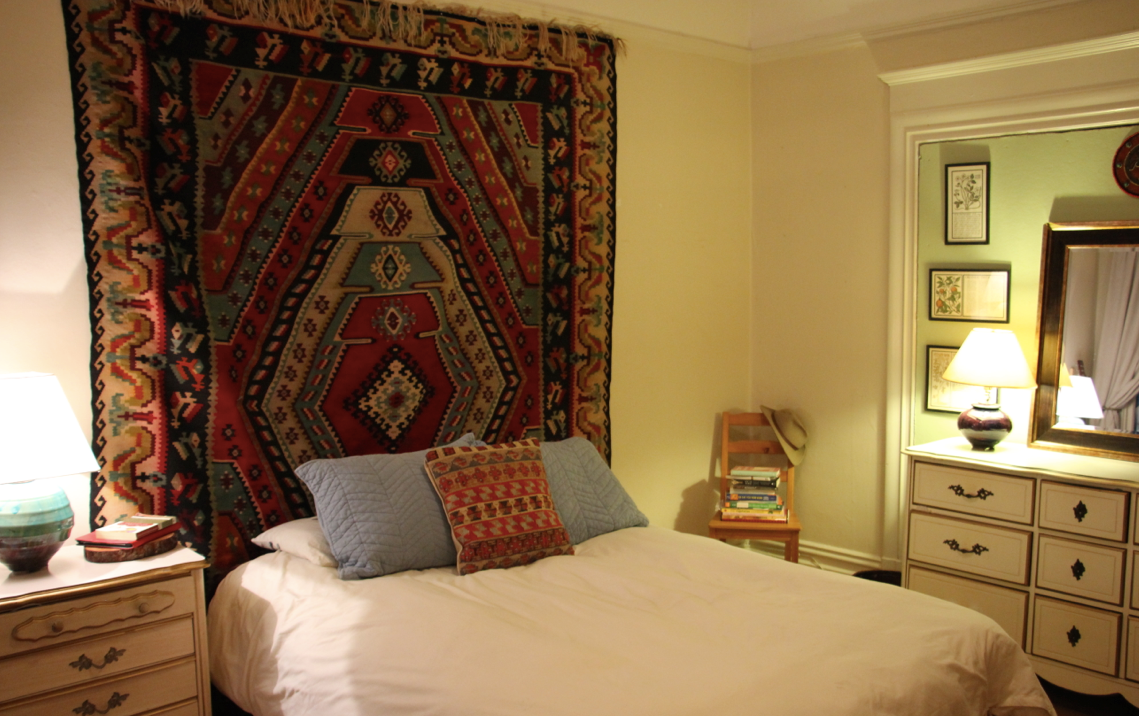After: The bed serves as the focal point of the bedroom, inviting Kira to pause, relax, and rest in her space.