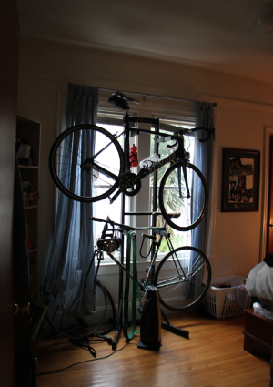 Before: Due to a cluttered living room, C was forced to store his bikes in his bedroom, blocking his only source of natural light and creating a feeling of chaos upon entering his bedroom.