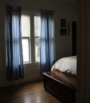 After: The subtly lit bedroom feels exponentially more restful and serene after removing the bikes and their racks.