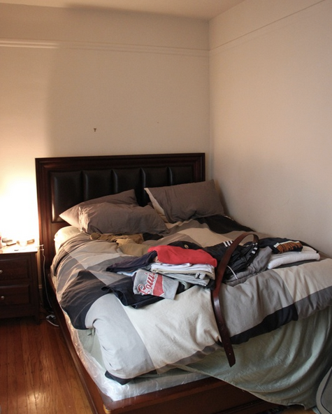 Before: The bed is pushed to the corner to make room for the wide swing of the closet door.