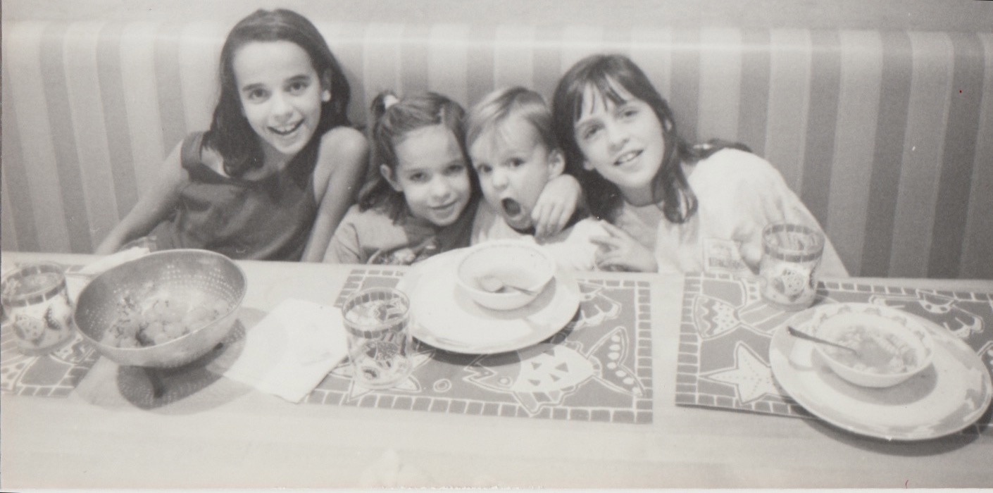 A daily, yet precious memory from childhood. Around the dinner table with my siblings: Lauren, Robin, Zack and myself. Yep, I know I had killer bangs. 