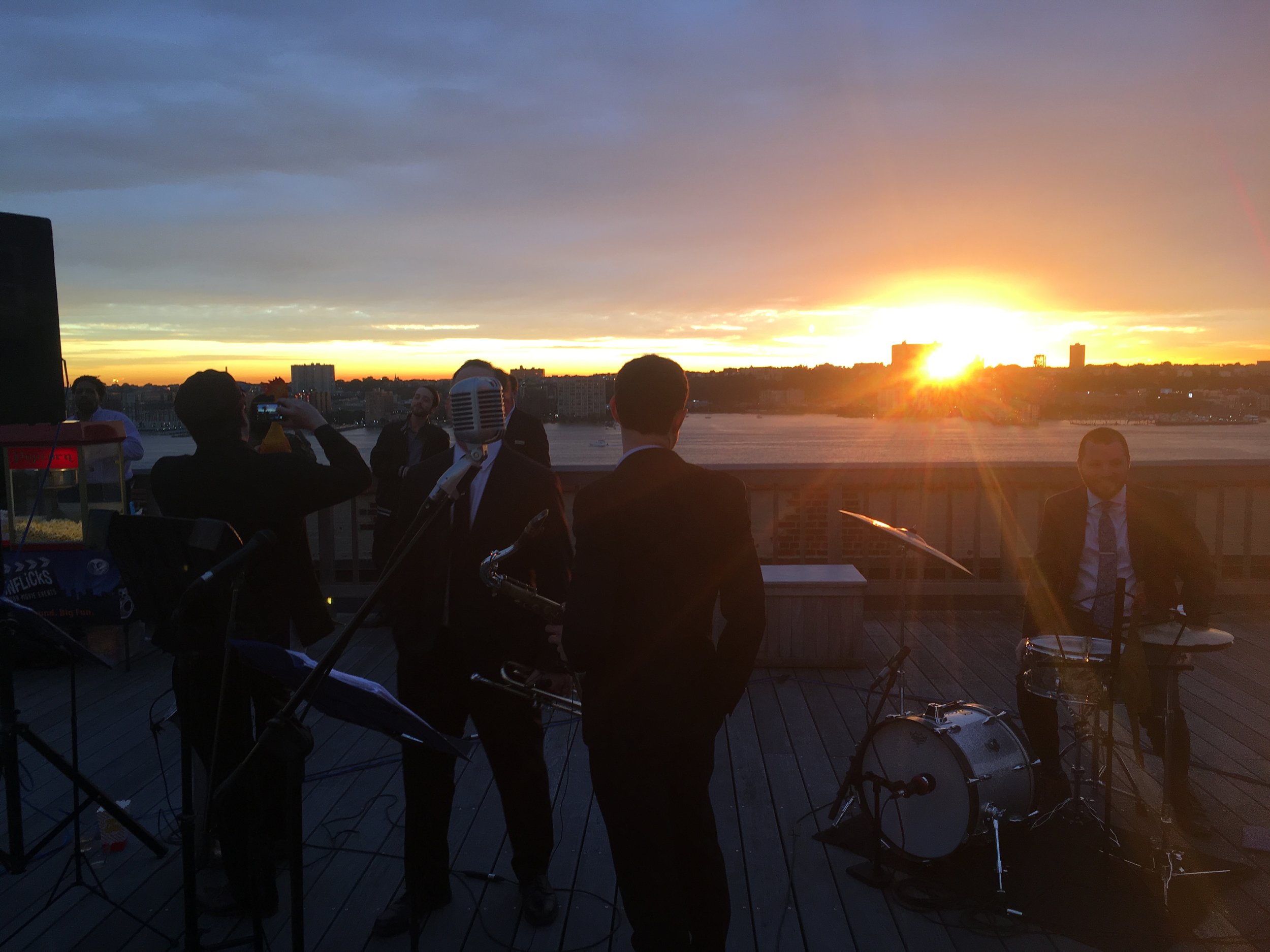 Beautiful sunset over the Hudson river with Peter and the Master Keys performing jazz and blues for a corporate event at the Starrett Le-High building in Chelsea, Manhattan.