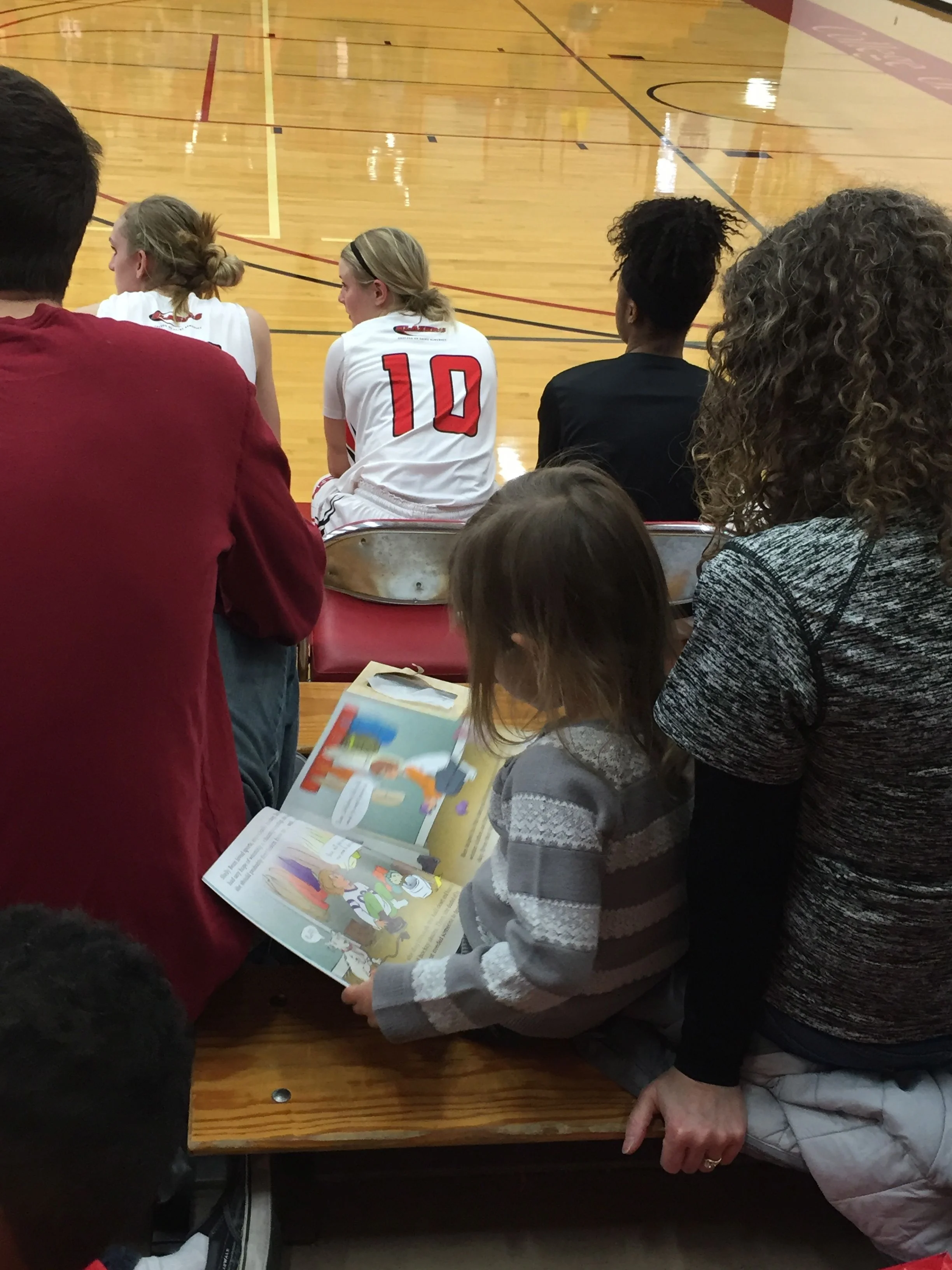 reader at the game.jpg