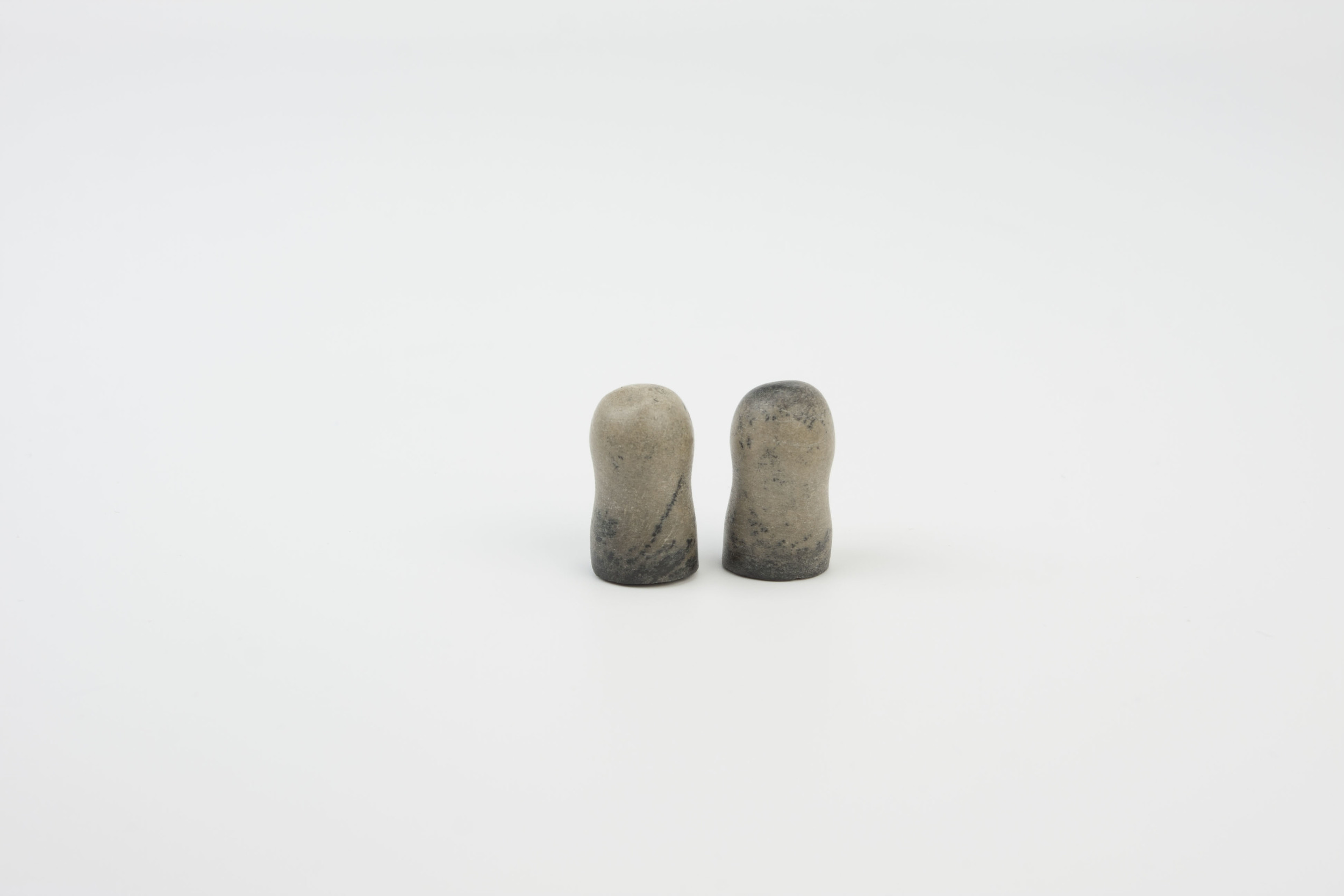 Earplugs - carved from the fossilized inner ear bone of a whale