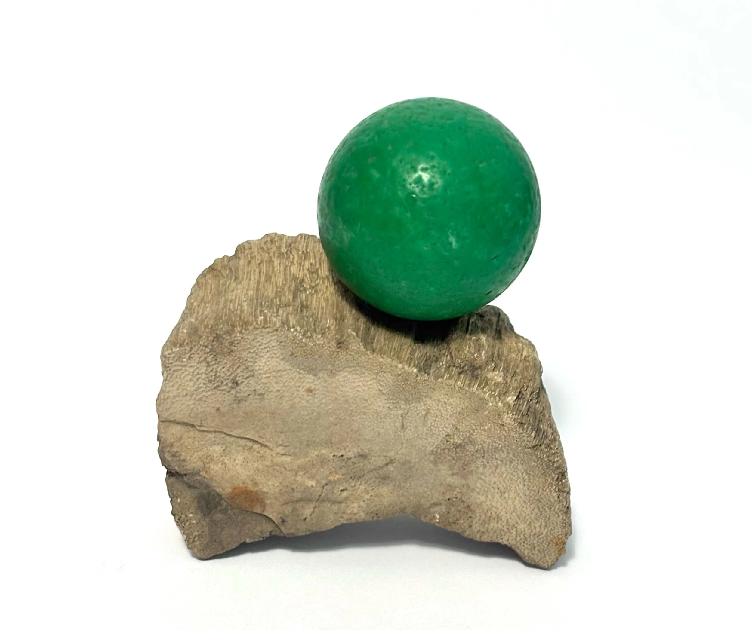 under (lucky tooth) - petrified wood under deceased friend’s favorite ball