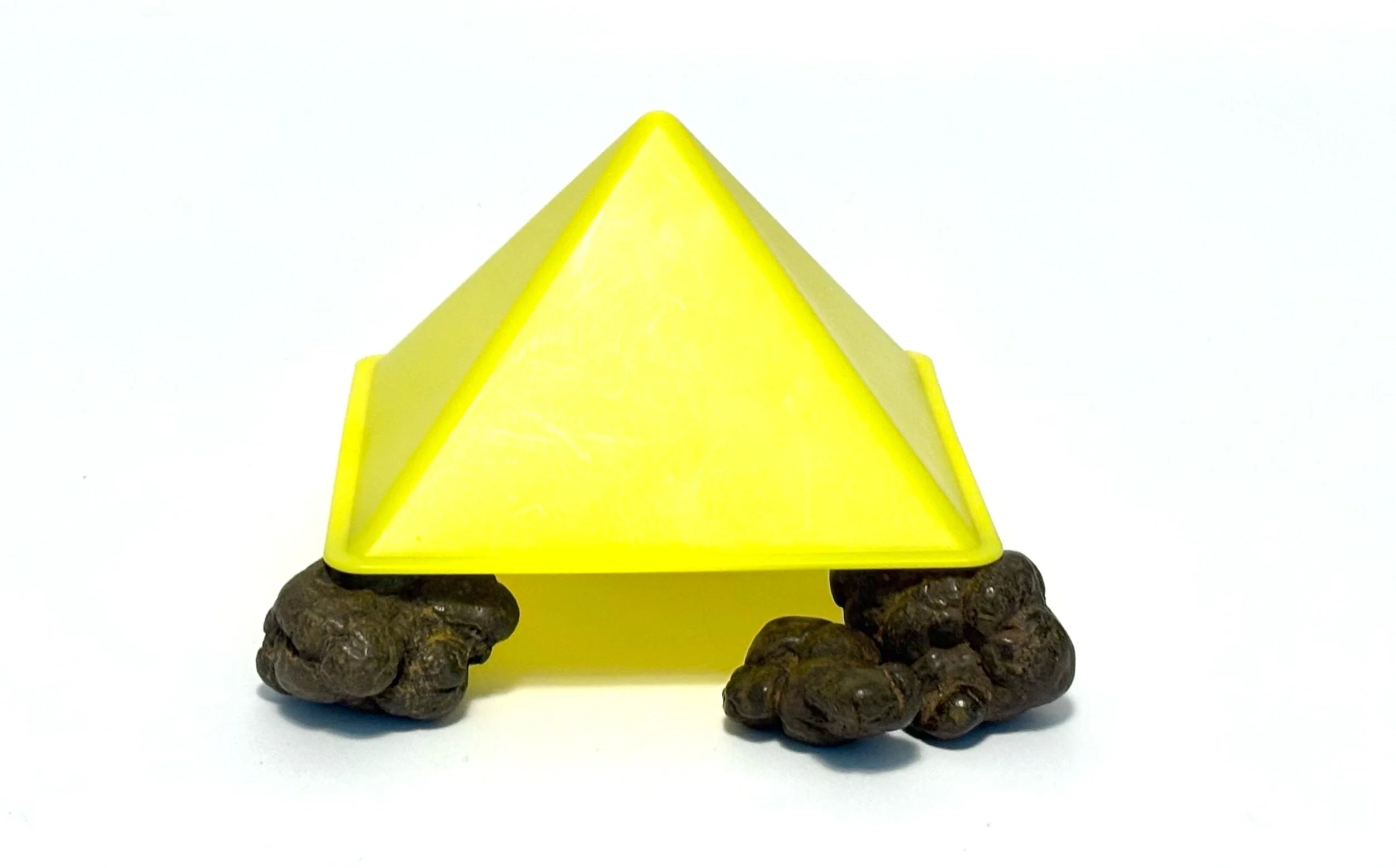 under - coprolite specimens (Miocene) under hape acrylic pyramid
