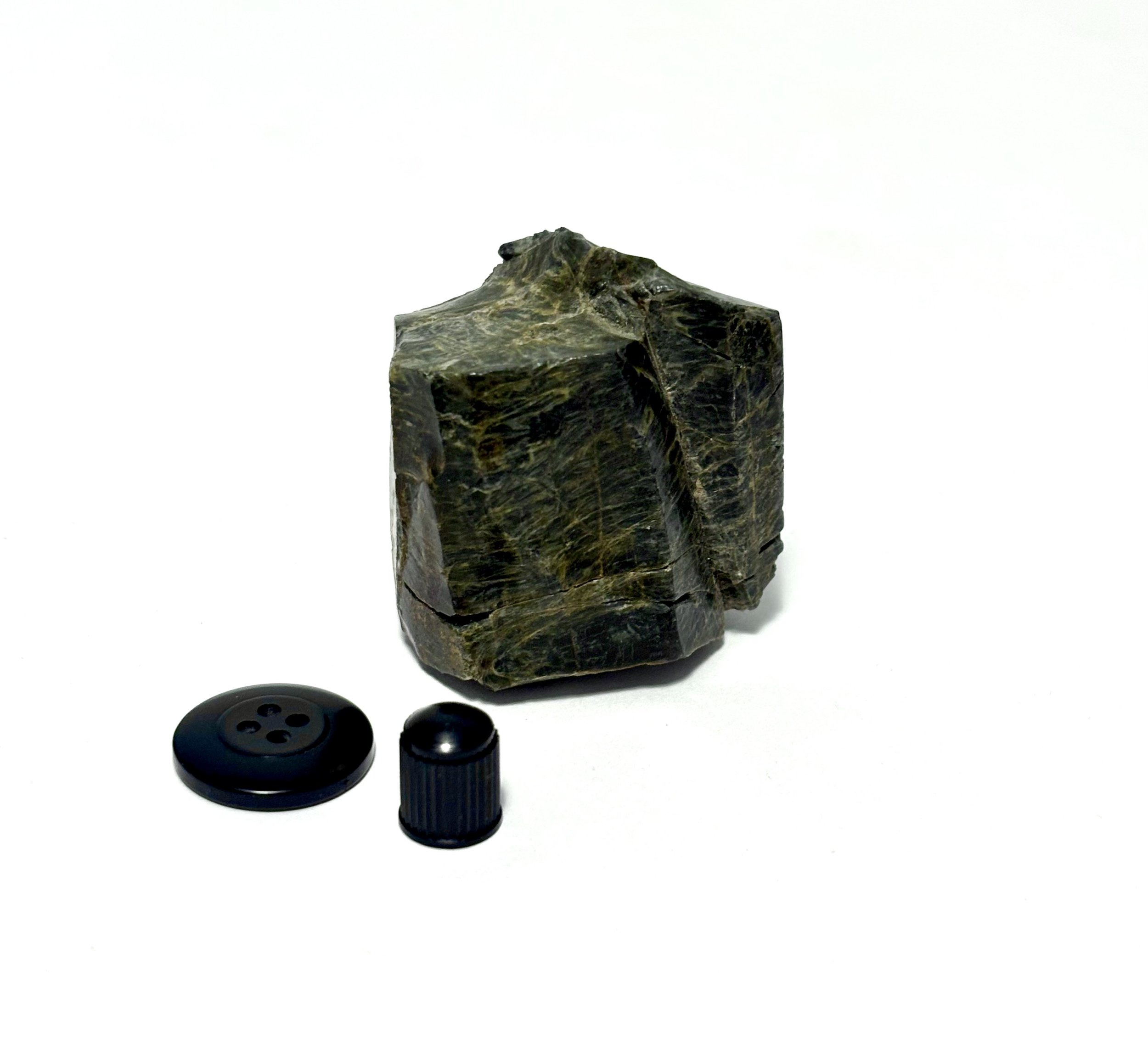 untitled - raw black onyx, cardigan sweater button, automotive valve stem cap
