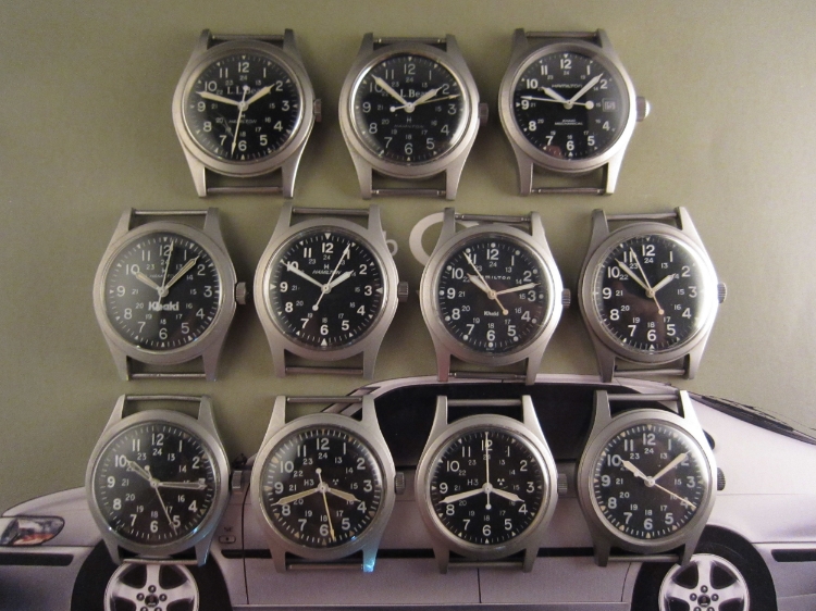 Top Row, L to R: LL Bean-branded ref 9415 with flat 3 font and Jet Age Hamilton logo; LL Bean-branded ref 9219 with flat 3 font and Jet Age Hamilton logo; ref H693190 with round 3 font and the curvy Art Deco Hamilton logo. Middle, L to R: ref 921980 with flat 3 font, Jet Age Hamilton logo, and big "Khaki"; ref 9415A with round 3 font, Jet Age Hamilton logo, and no "Khaki"; ref 9415A with big round 3 font, curvy Art Deco Hamilton logo, and little "Khaki"; ref 9415 with big round 3 font and sterile dial. Bottom, L to R: MIL-W-46374A with tall flat 3 font and sterile dial; MIL-W-46374B with flat 3 font and H3/rad waste dial; MIL-W-46374D with flat 3 font and H3/rad waste dial; GG-W-113 with thicker flat 3 font and sterile dial. 