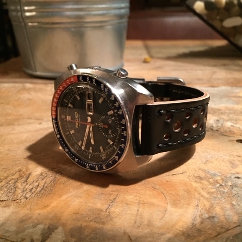 Seiko 6139 on a one-off rally-style Arts & Crafts strap in Black shell.