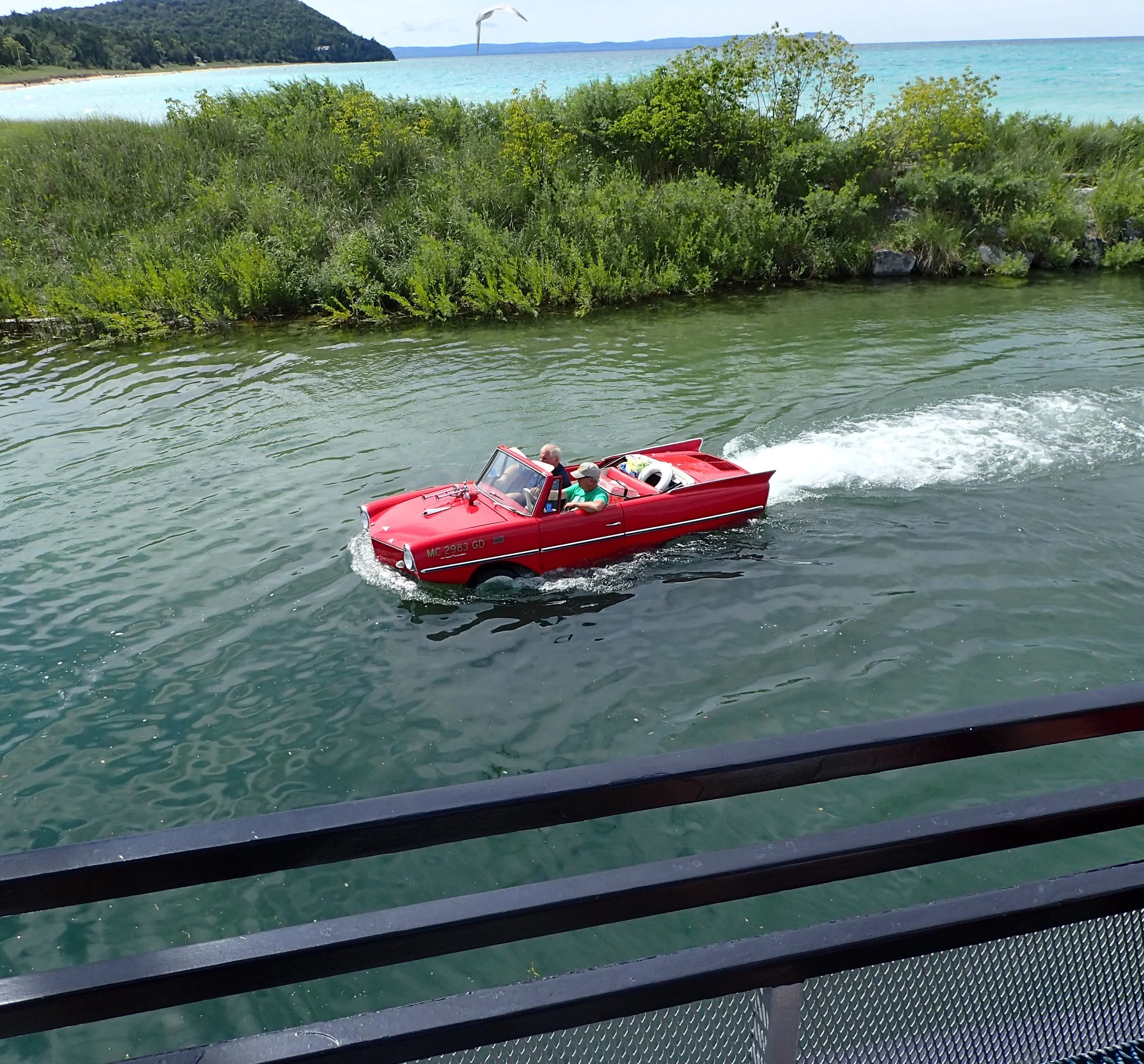 The Amphicar cruising by our docked ferry prior to our departure. 