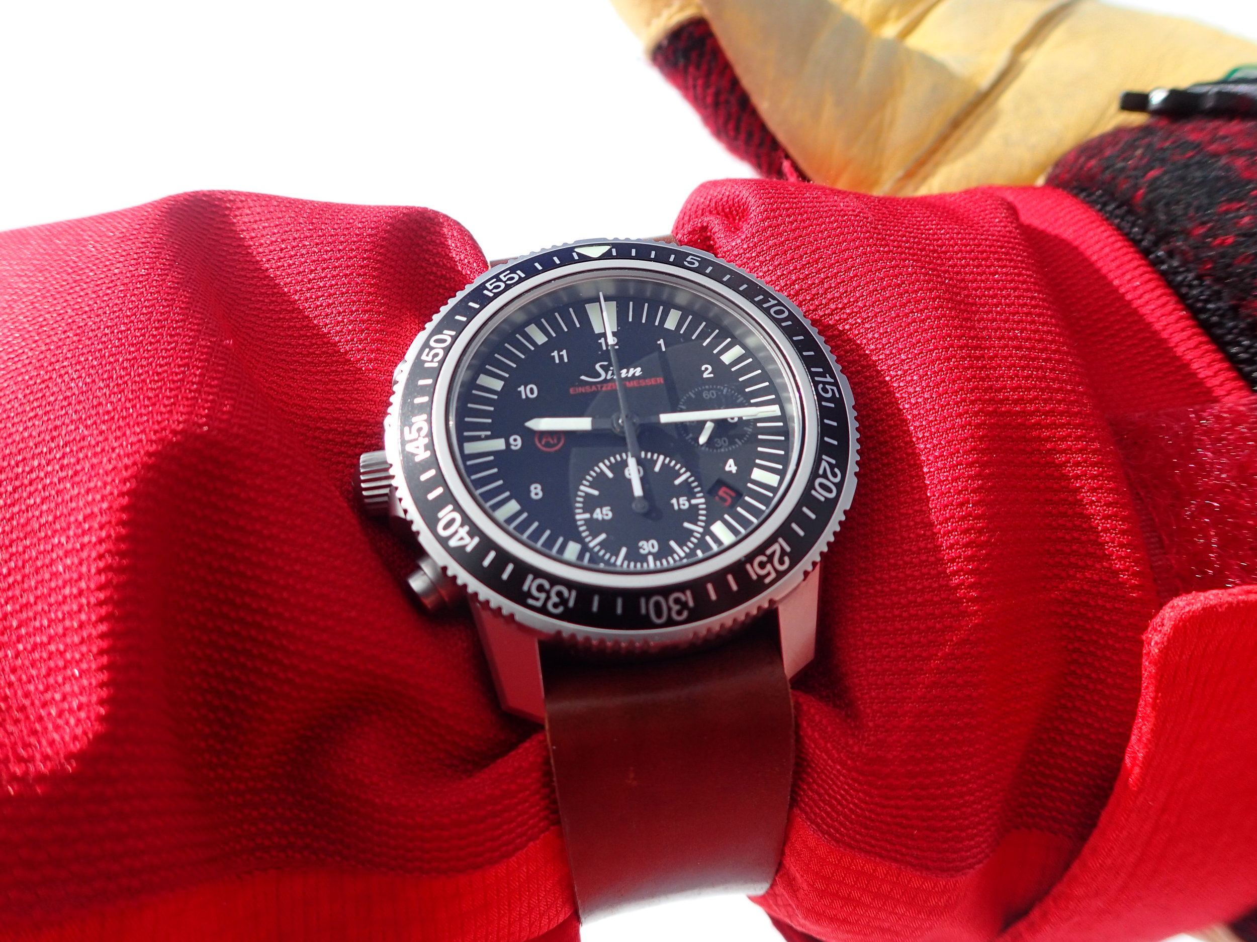 An extra-long one-piece strap makes it easy to wear the Sinn over a coat sleeve. 
