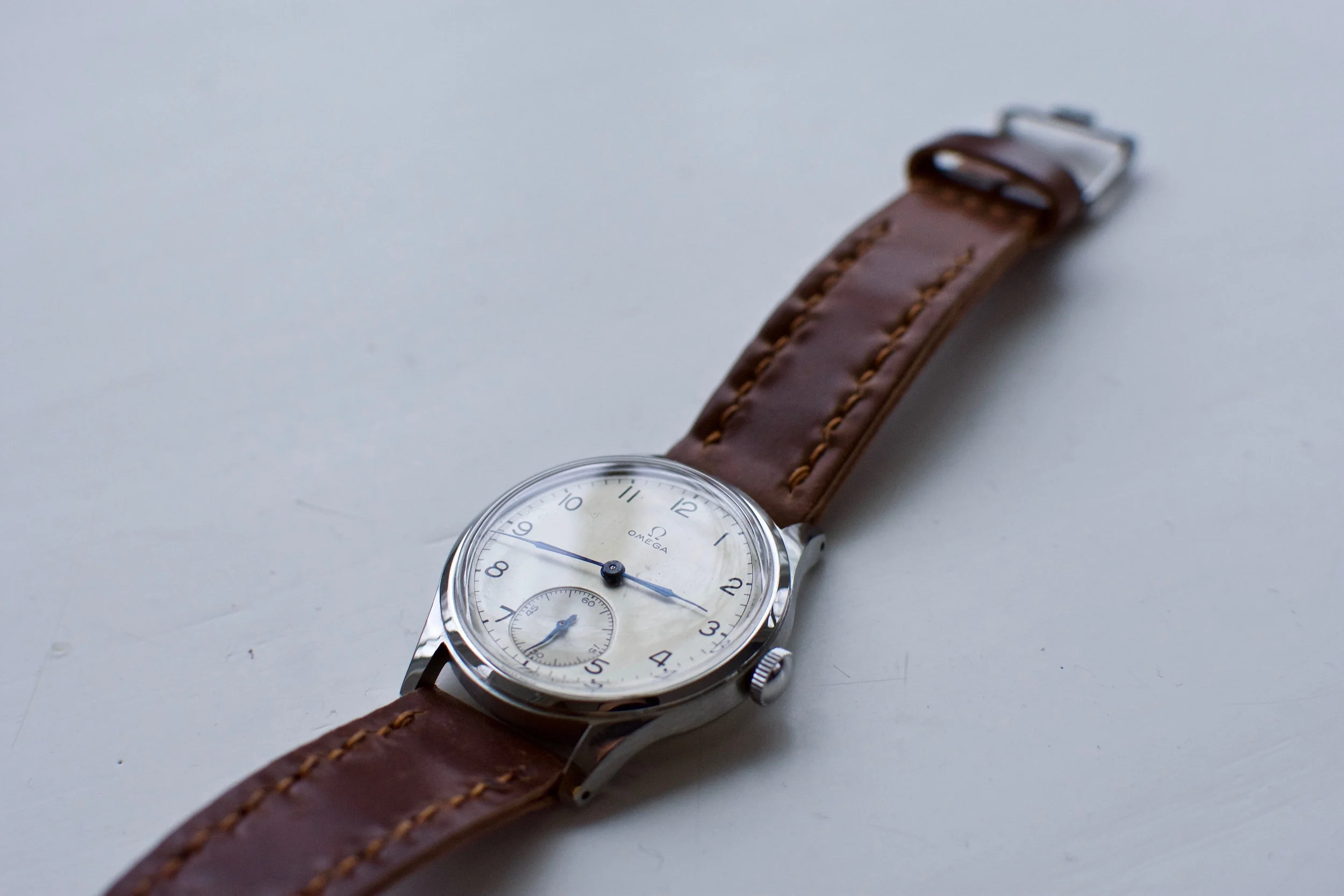 A vintage Omega small seconds on a Cognac Arts & Crafts. All-time classic.