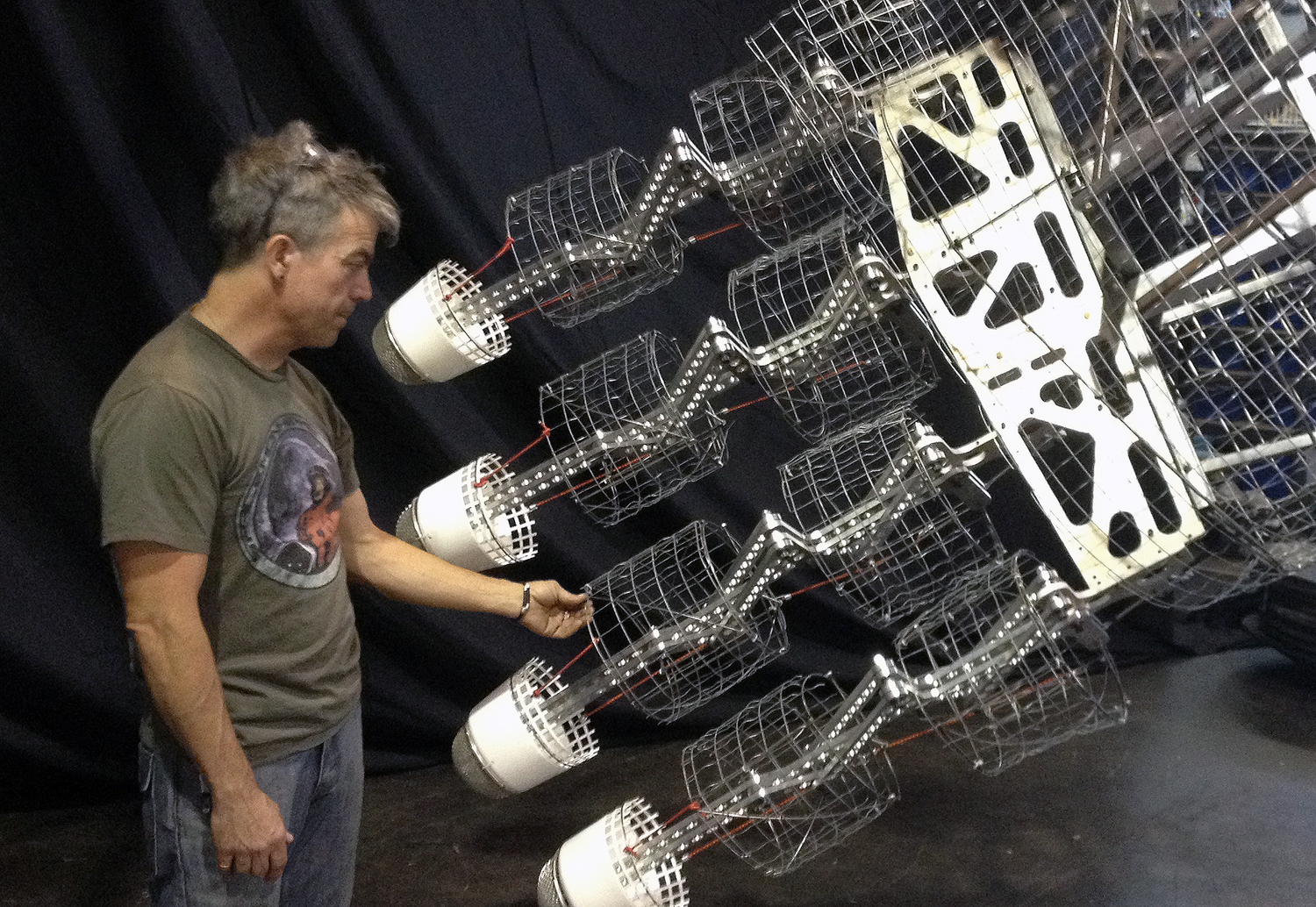 A closer look reveals techniques of digital fabrication to produce the water-jet cut aluminum substructure that comprise the custom hand/finger joint connections.