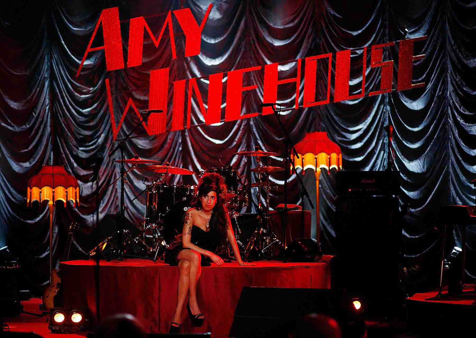 2008 Singer Amy Winehouse waits on stage at Riverside Studios during the 50th Grammy Awards ceremony. London, England.