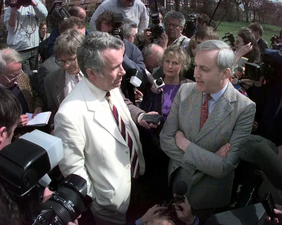 MP Neil Hamilton (right) meets his opponent, former BBC war correspondent Martin Bell (left), on Knutsford Heath during the general election. Cheshire, England. April 1997.