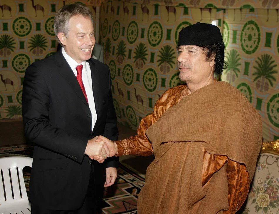 Prime Minister Tony Blair (L) meets with Colonel Gaddafi in his tent near Sirte, Libya. May 2007.