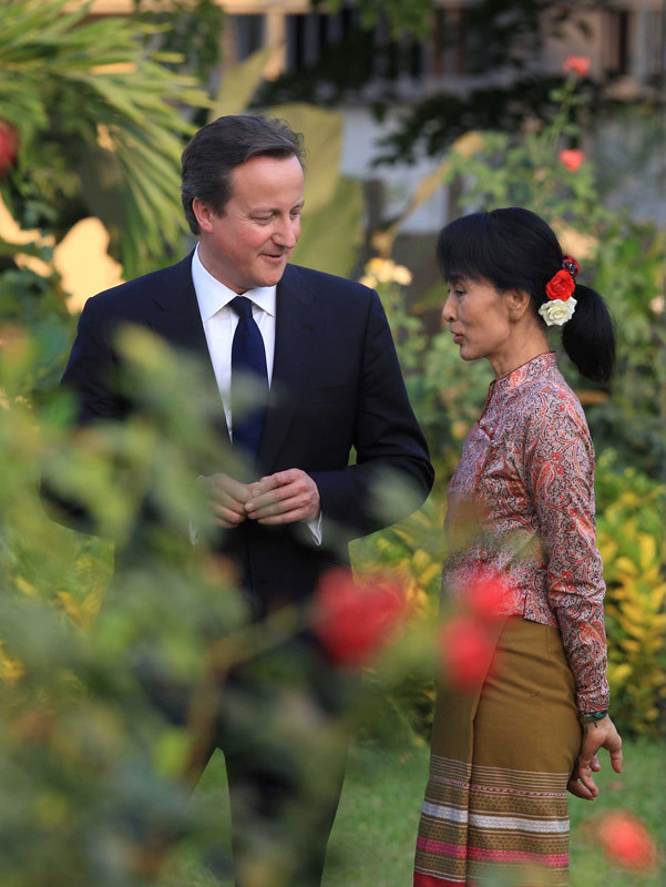 Prime Minister David Cameron walks with pro-democracy leader Aung San Suu Kyi in her garden. Yangon, Myanmar. April 2012.