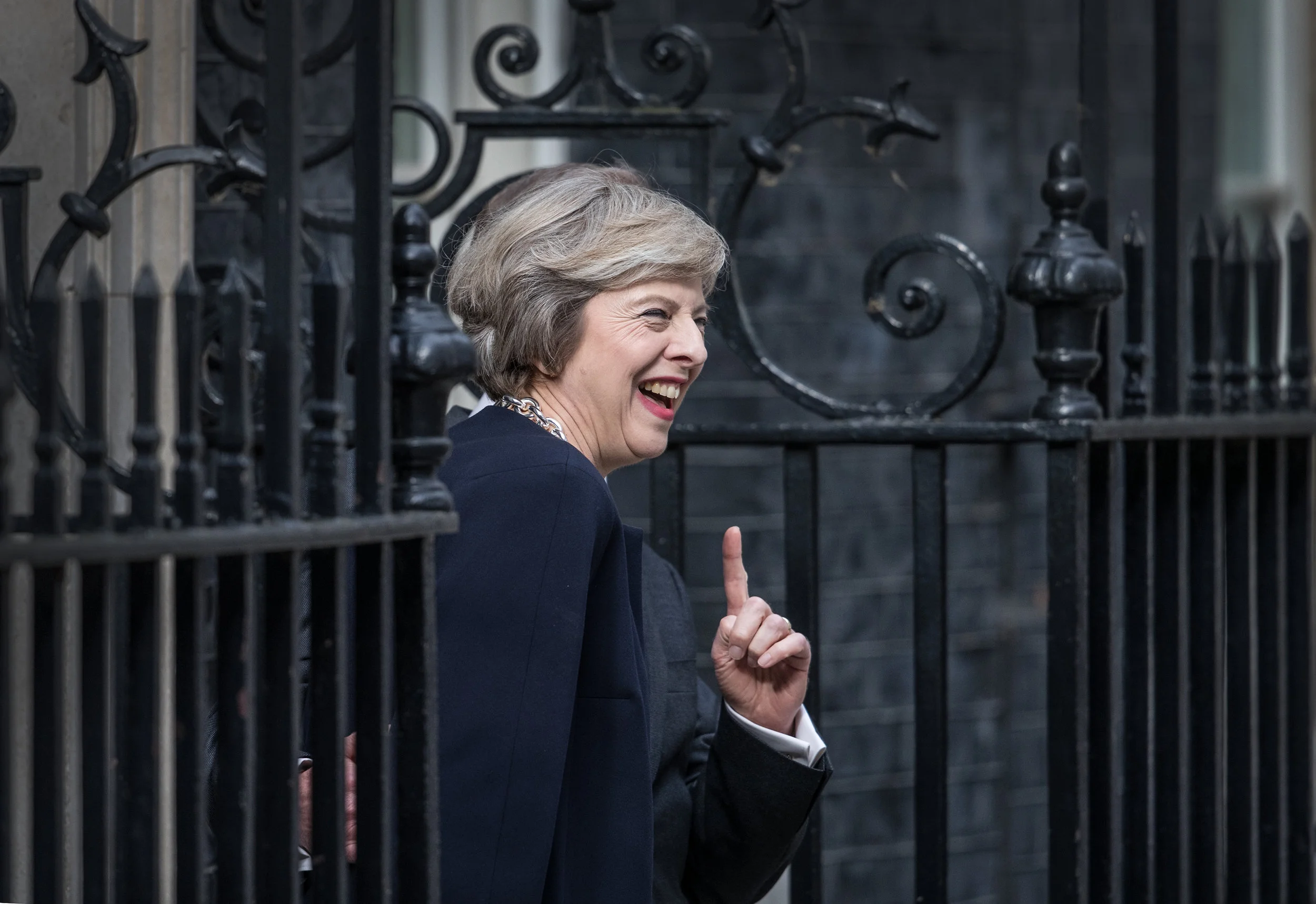 Theresa May smiles as she arrives in Downing Street for the first time as Prime Minister. July 13, 2016. London.